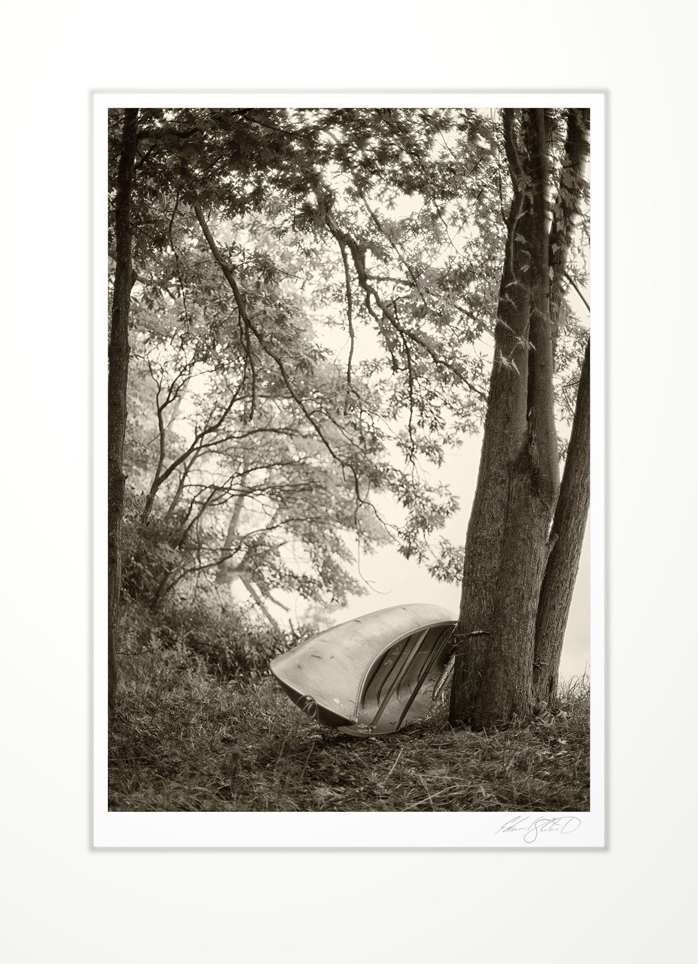 An overturned canoe by The Grand River at Eaton Rapids, Michigan -September, 2013