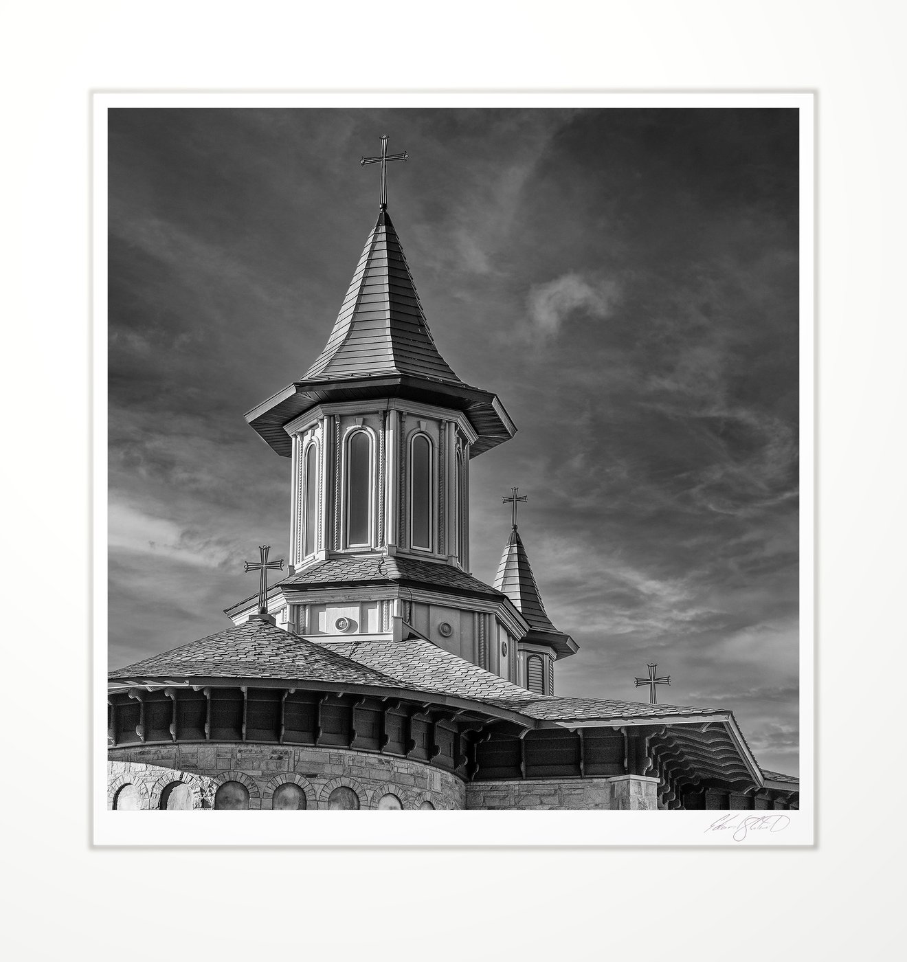A monastery steeple against a clouded sky. Rives Junction, Michigan -November, 2022