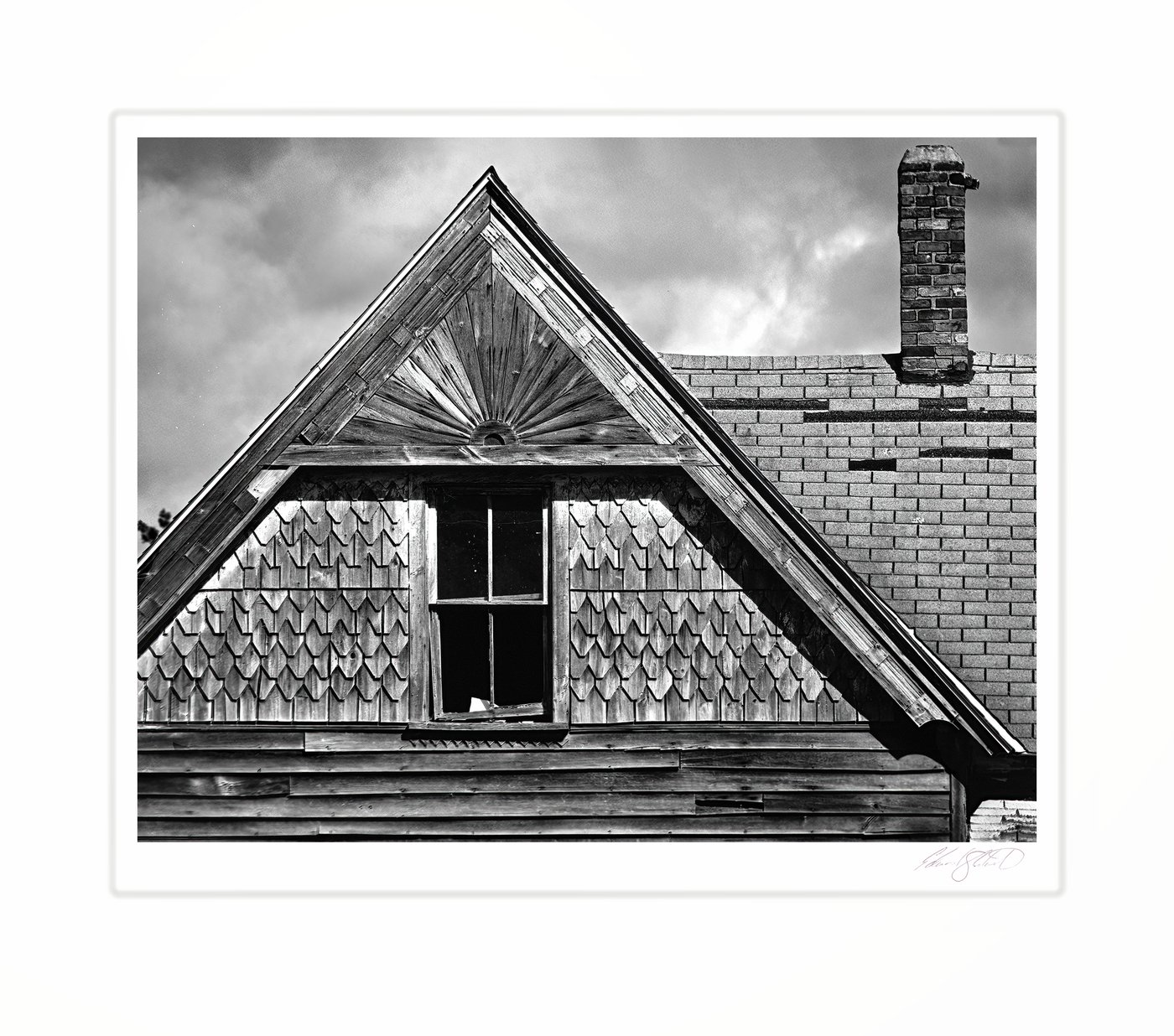 The gabled roofline and chimney of an old farmhouse. Kinde, Michigan area -April 2025