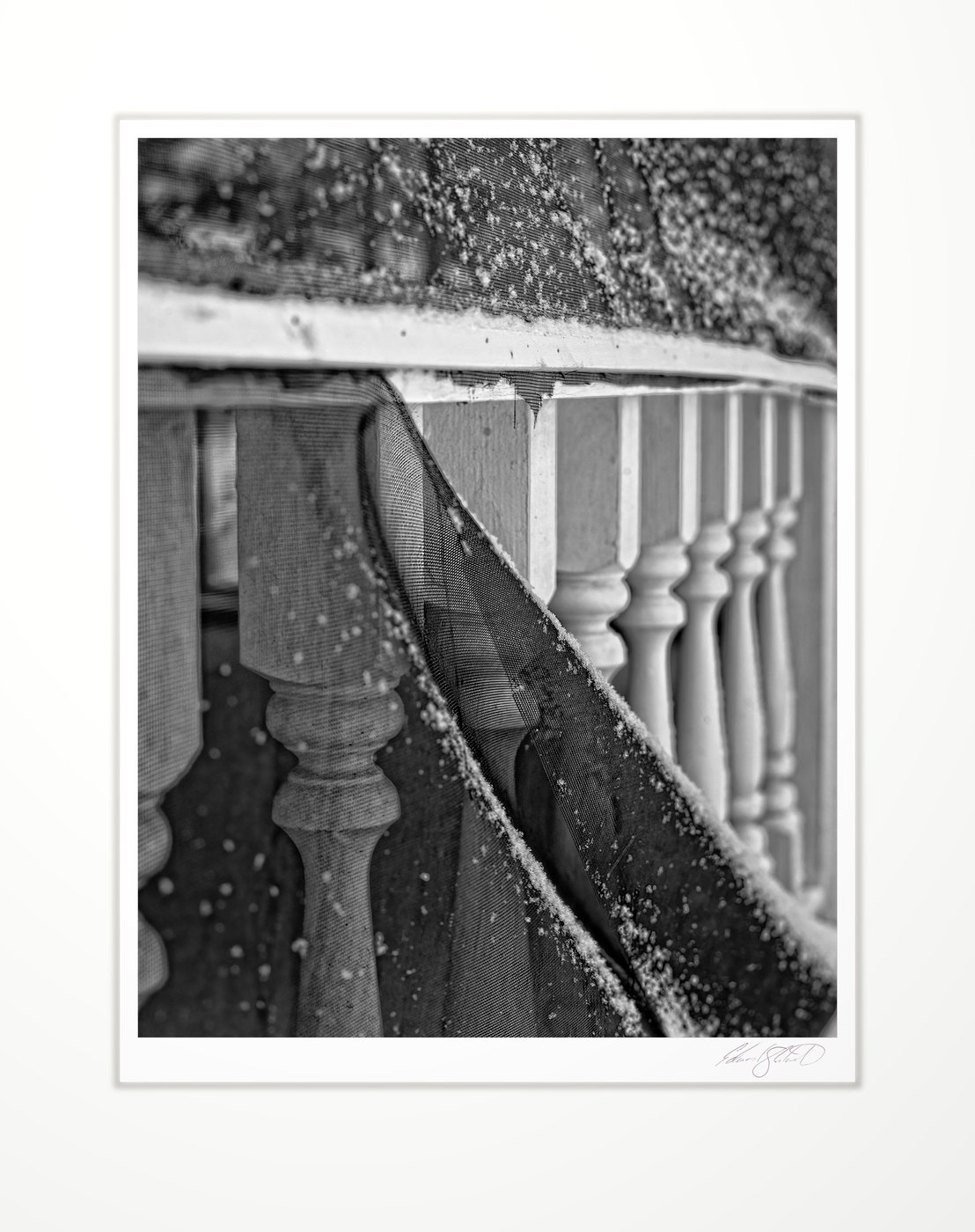 A torn porch screen and railing in the snow. Eaton Rapids Campground -2013