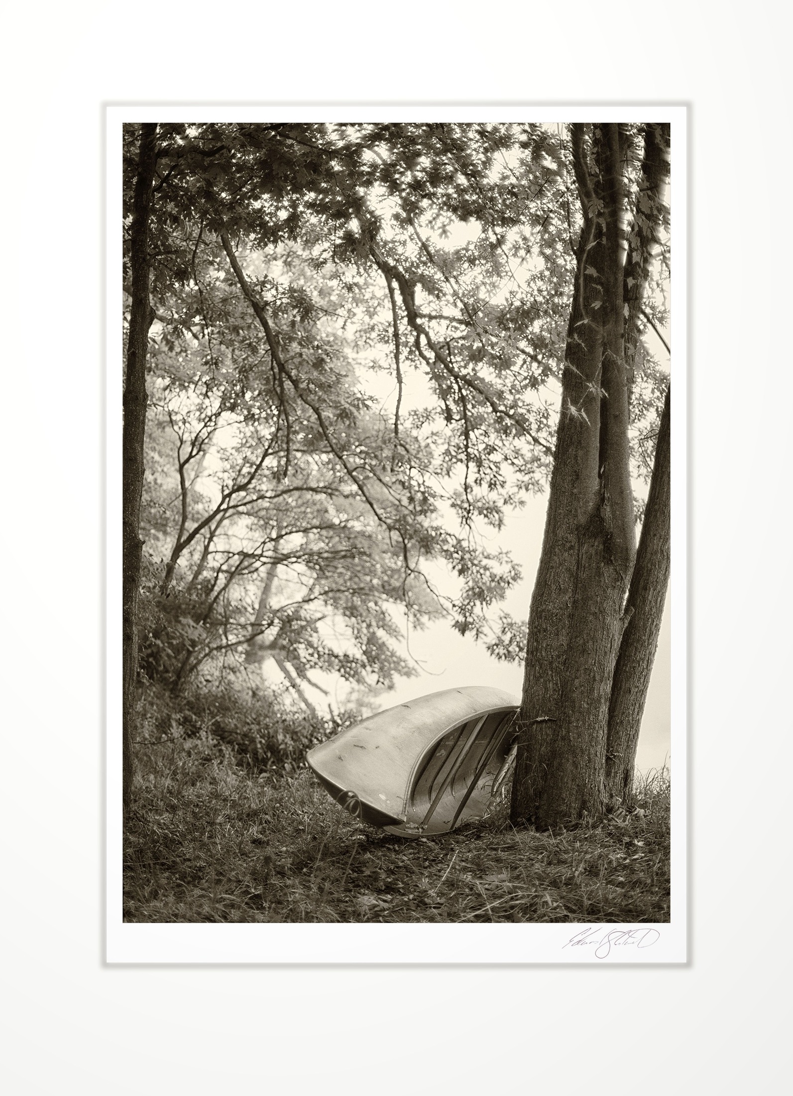 An overturned canoe by The Grand River at Eaton Rapids, Michigan -September, 2013