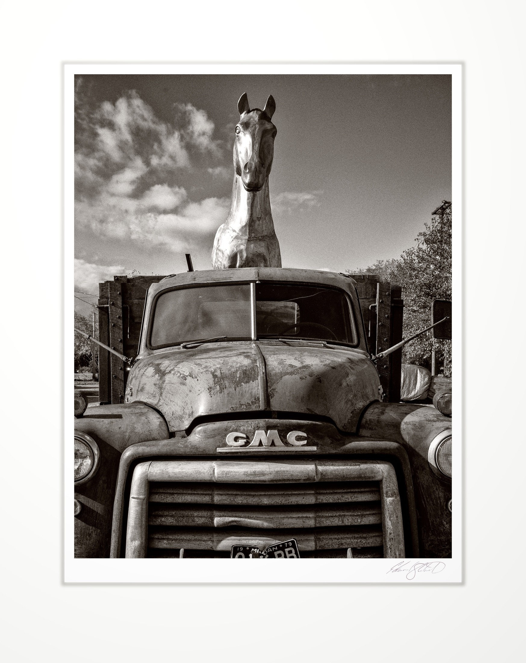 A vintage GMC truck with a horse sculpture mounted in the back Unionville, Michigan -November, 2019